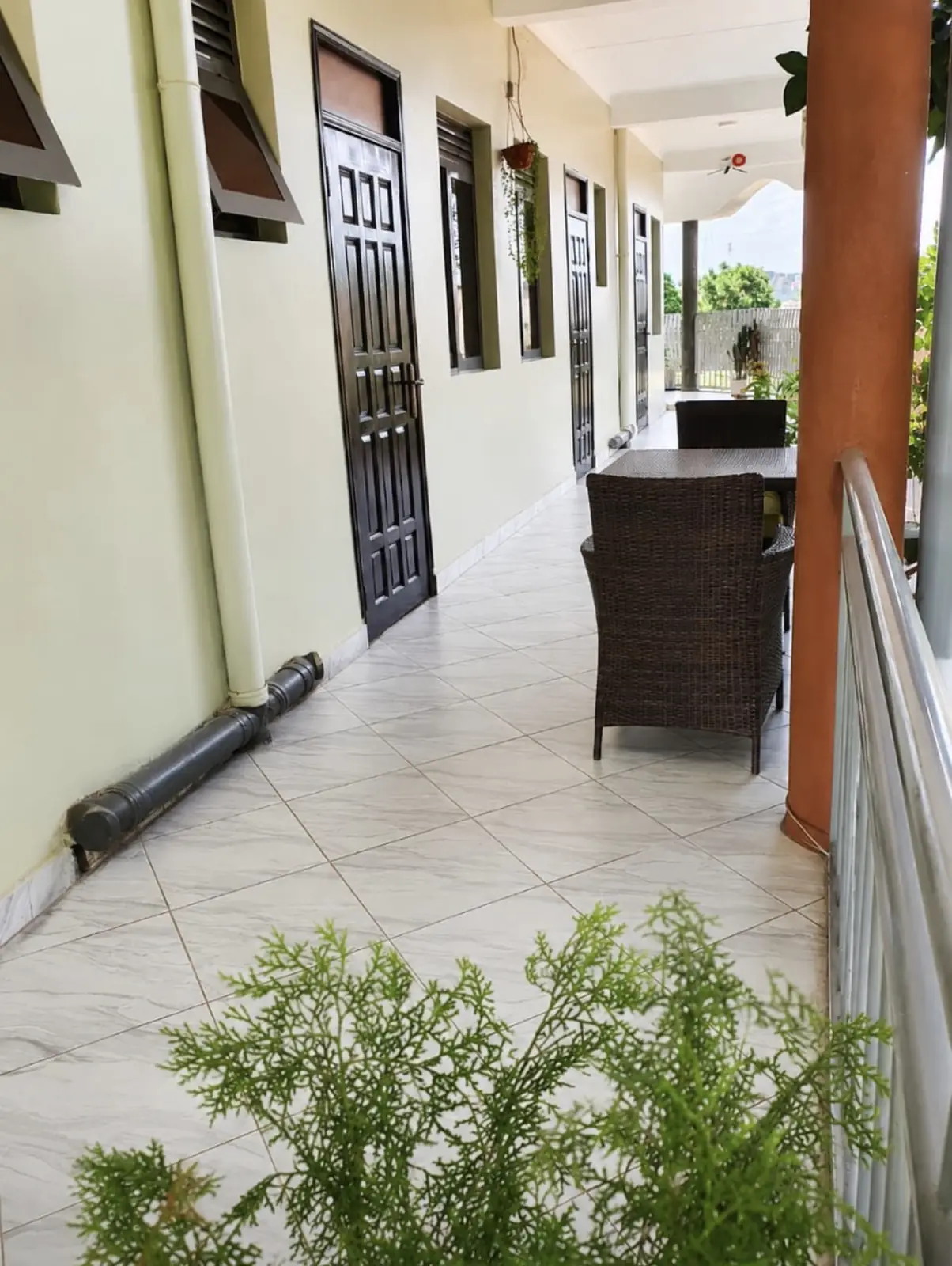 Guest room seating detail at NOAZ Hotel Kampala